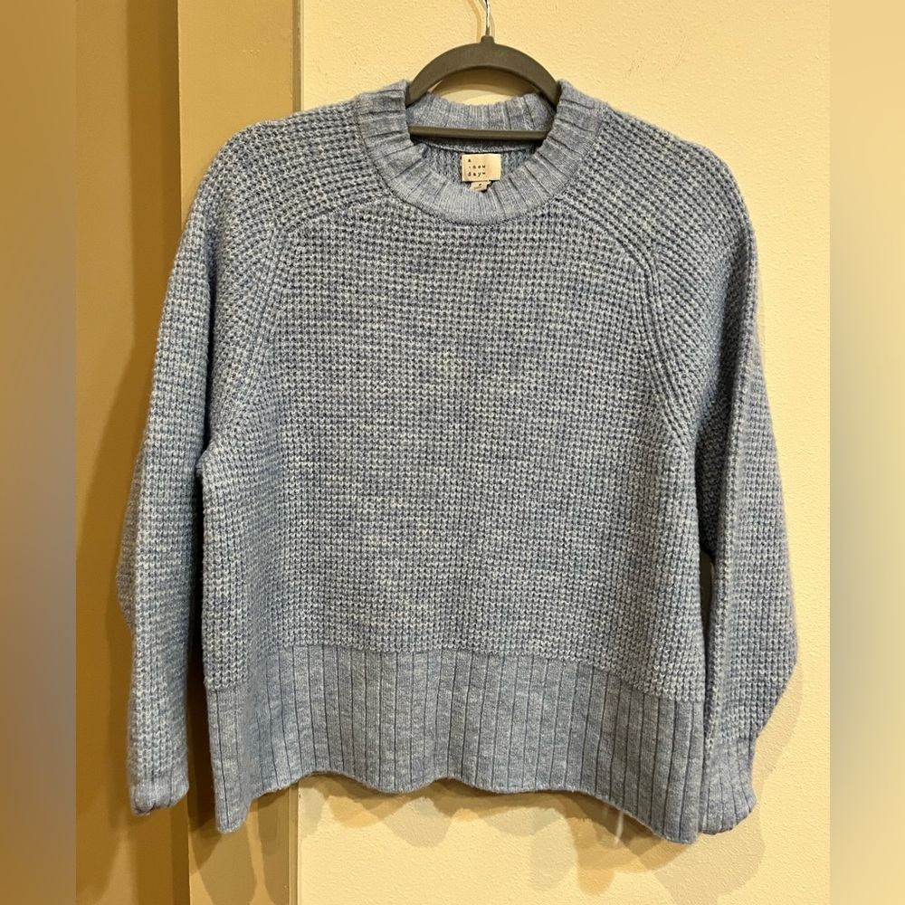 Light blue sweater